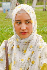 Close-up of woman wearing hijab in park