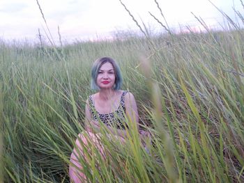 Young woman standing on field