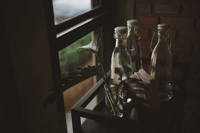 Close-up of bottles on table at home