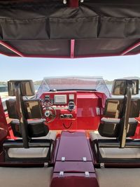 Close-up of red seats in bus