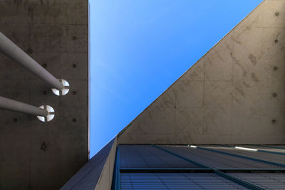 Low angle view of building against blue sky