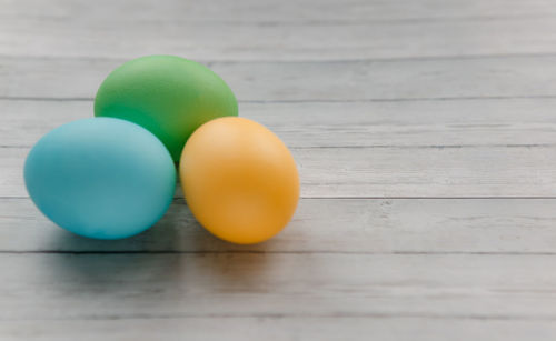 Close-up of multi colored eggs on table