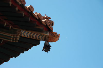 Low angle view of temple against clear blue sky