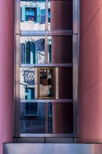 Reflection of window on glass door at home