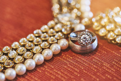 High angle view of jewelry on red table