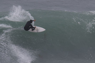 High angle view of man surfing in sea