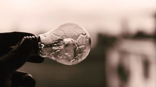 Close-up of hand holding bubbles