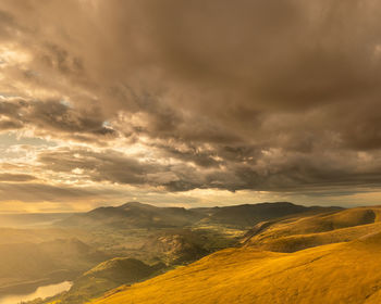 Scenic view of landscape against sky during sunset