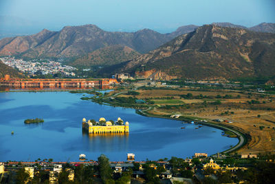 High angle view of jal mahal in lake against mountains