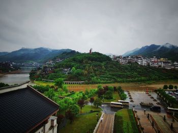 High angle view of buildings in town against sky