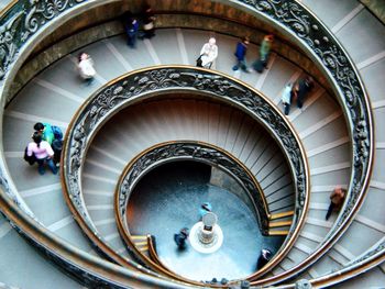 High angle view of people on spiral staircase