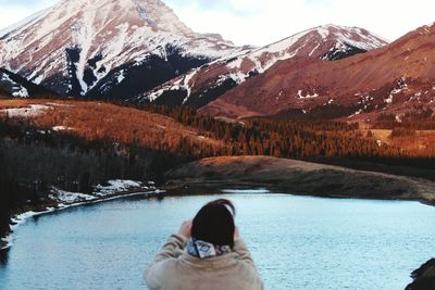 Scenic view of lake with mountains in background