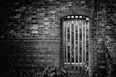 Metal structure against brick wall