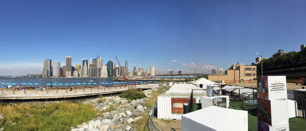 View of cityscape against blue sky