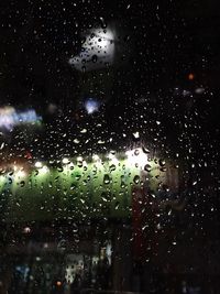 Close-up of water drops on glass window