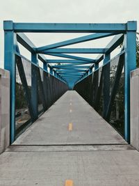 Footbridge against sky