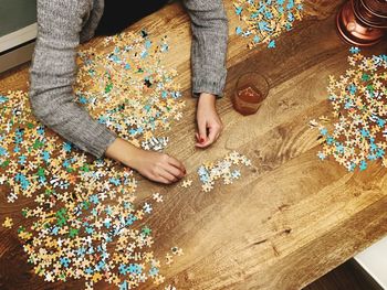 High angle view of child playing on table