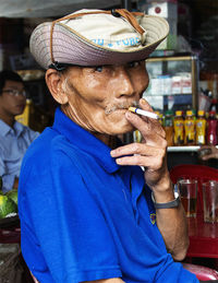 Portrait of man wearing hat looking away