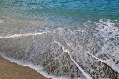 High angle view of surf on beach