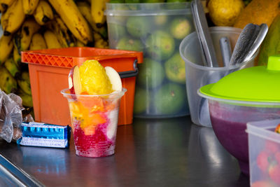 Preparation of a traditional sweet water ice with fruits called cholado in the city of cali colombia