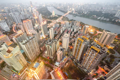 High angle view of illuminated modern buildings in city