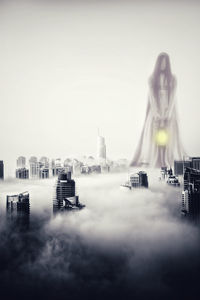 Panoramic view of buildings in city against sky