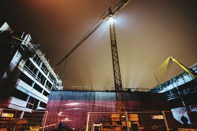 Low angle view of crane at construction site