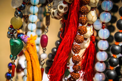 Close-up of beads hanging for sale