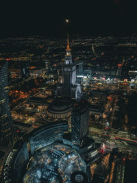 High angle view of illuminated buildings in city at night