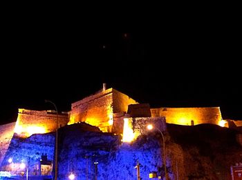 Low angle view of illuminated lights at night