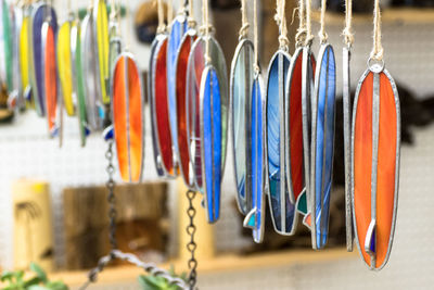 Close-up of multi colored hanging for sale in market