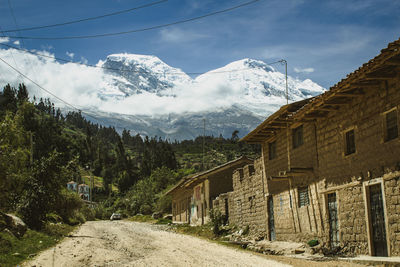 Scenic view of the road to snowcapped huascaran against sky