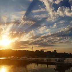 Sun shining over river