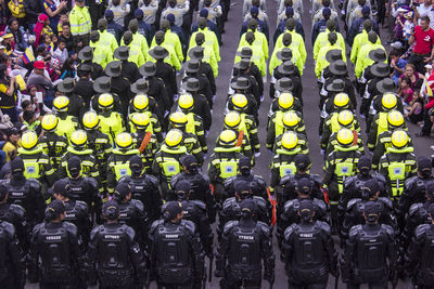 High angle view of people in uniform standing on road