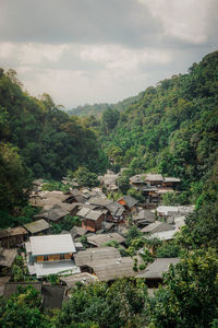 High angle view of trees and buildings against sky