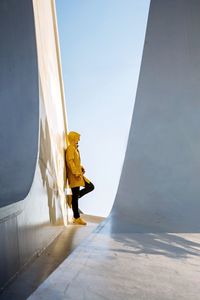 Man in raincoat on the road