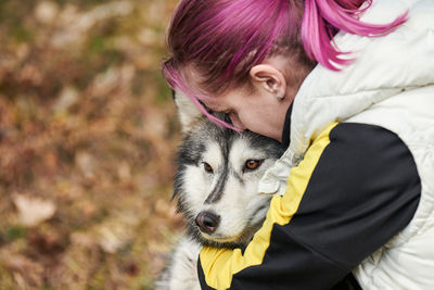 Portrait of young woman with dog