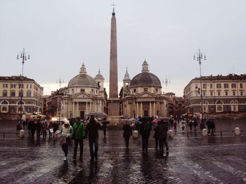 Tourists in front of building