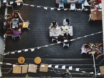 High angle view of people sitting on floor