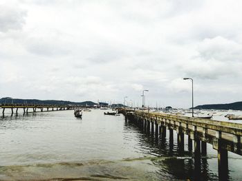 Pier over sea against sky