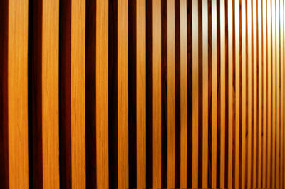 Wooden slats on wall in modern interior. abstract background. wooden wall. side view.