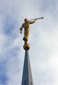 Sculpture of angel moroni atop of a mormon temple in san diego.