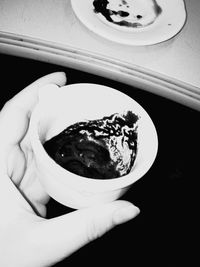High angle view of hand holding ice cream
