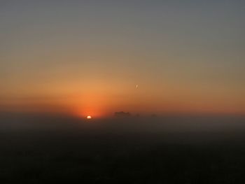 Scenic view of landscape against sky during sunset