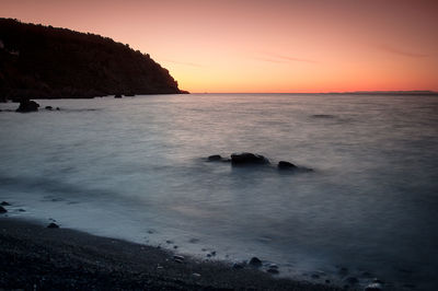 Scenic view of beach against clear sky