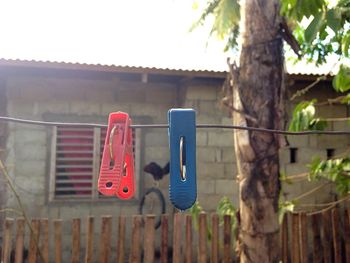 Clothespins on wire during sunny day