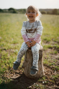 Portrait of a smiling girl on field