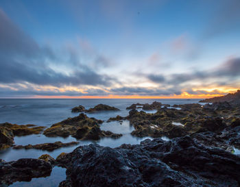 Scenic view of sea against sky during sunset