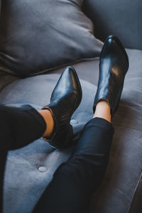 Low section of woman sitting on floor