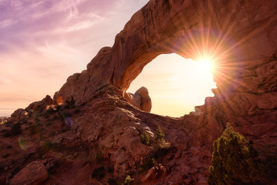 View of rock formation against sky during sunset